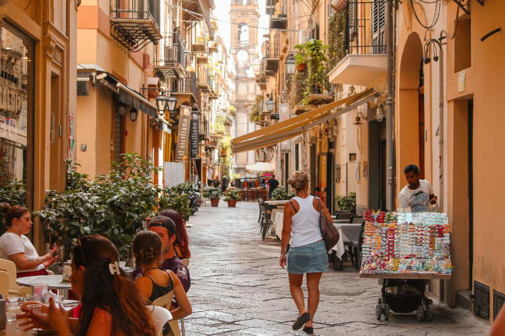 woman walking down the street in Sicily