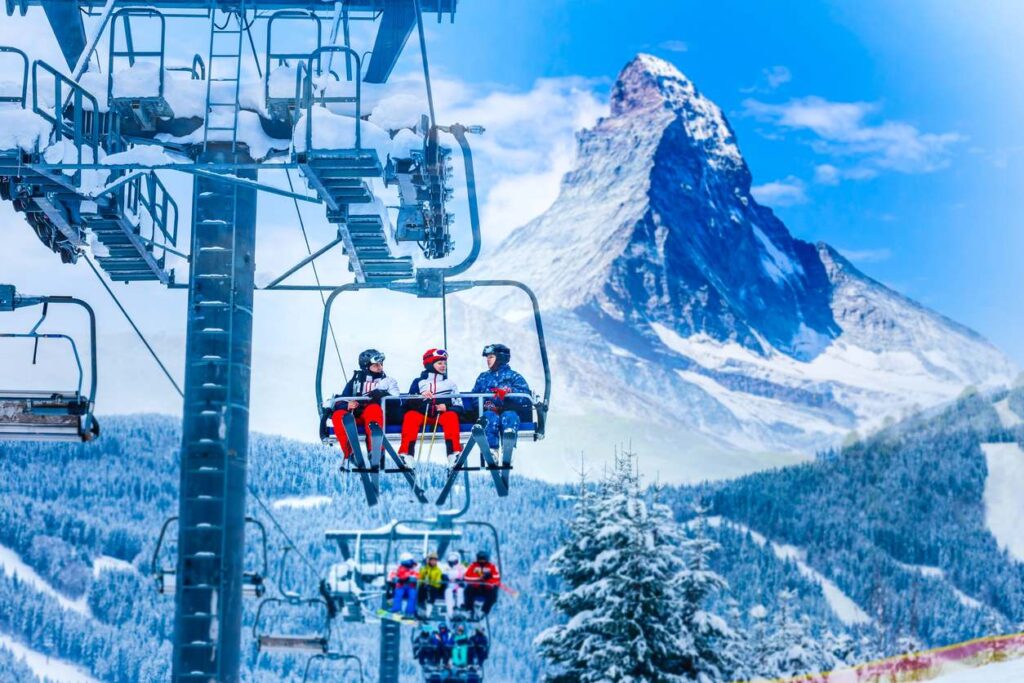 skiers on chairlift in Switzerland
