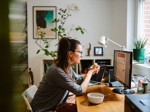 woman booking flight on computer