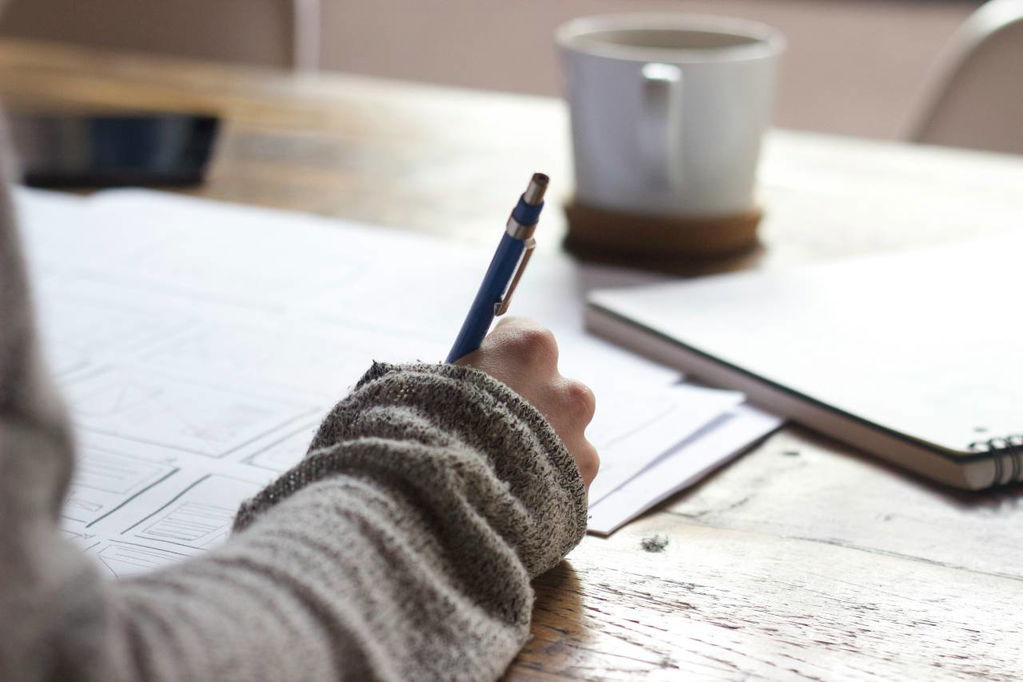 person writing list