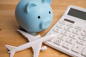 piggy bank next to model plane